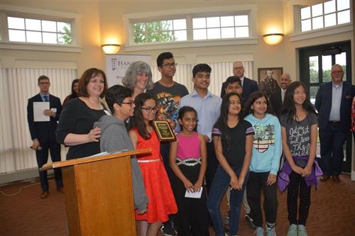 Ellen Smith with her students and her Celebration of Leadership Award 